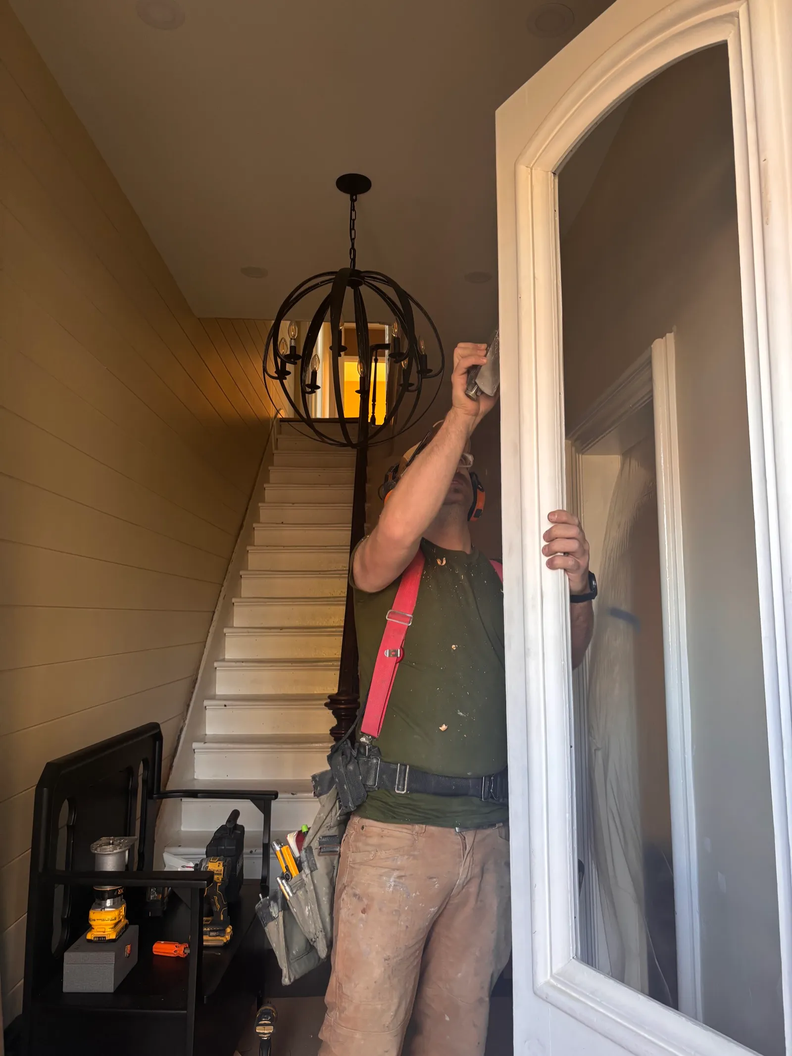 Brett Walker, owner of Walkercraft Carpentry, installing trim in a Hamilton home