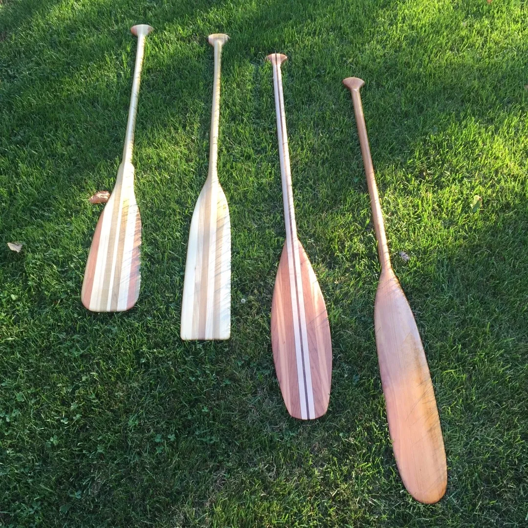 Four handcrafted multi-wood canoe paddles by Walkercraft Carpentry
