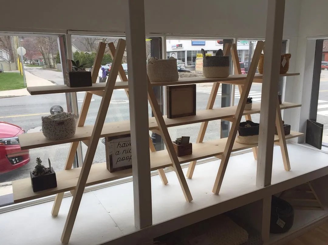 Custom A-frame display shelving for retail storefront by Walkercraft Carpentry